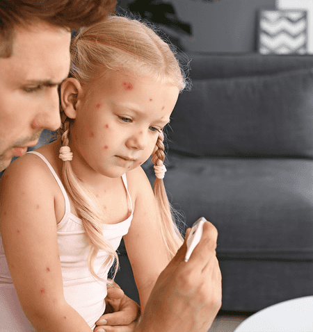 Child and father taking her temperature